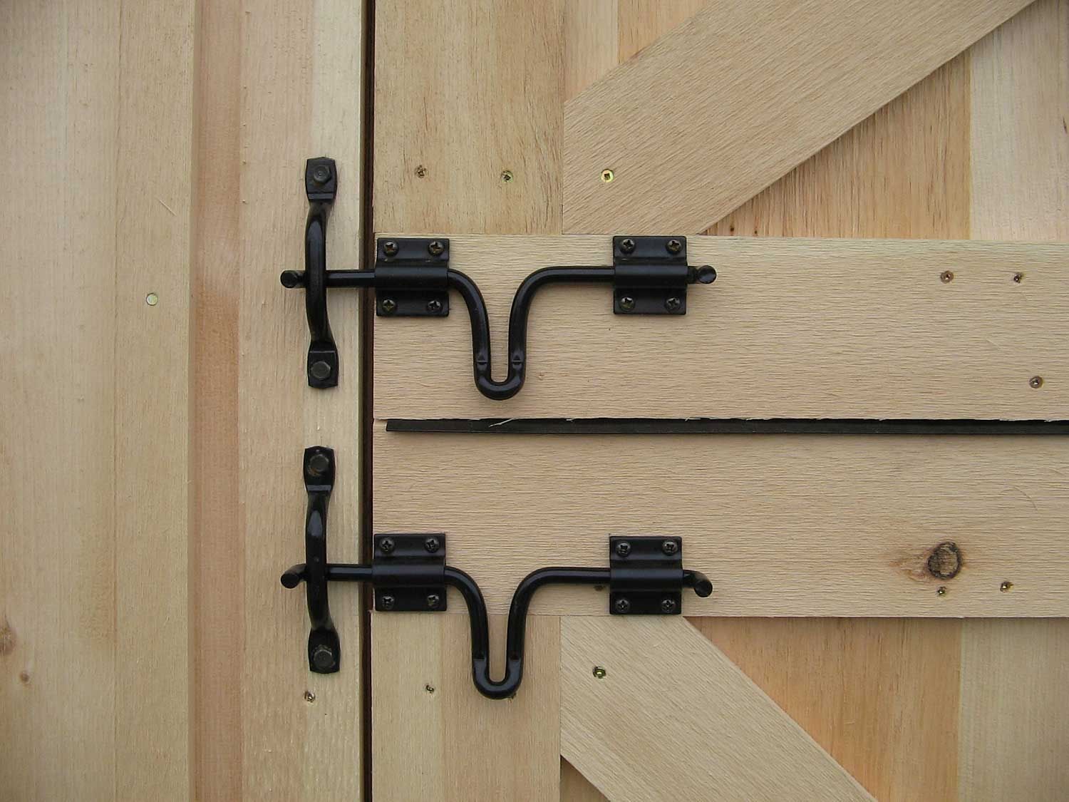 A sturdy barn door with a two-step secure latch.